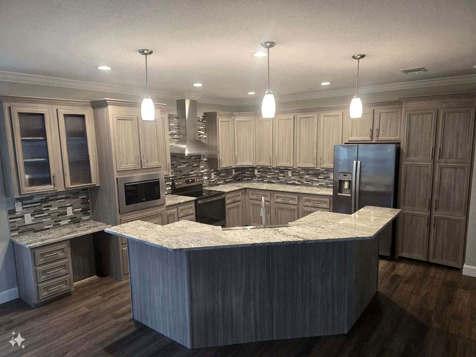 Modern kitchen with gray cabinets, granite countertops, stainless steel appliances, and pendant lights.
