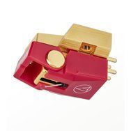 Red and gold vinyl record player cartridge with stylus and metal pins on white background