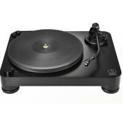 Black turntable record player with platter and tonearm on a white background
