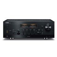 Black stereo receiver with illuminated display and multiple knobs on a white background
