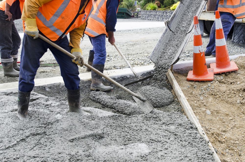 Construction Workers in Orange Safety Vests — About Time Plumbing & Civil Construction in Moss Vale, NSW