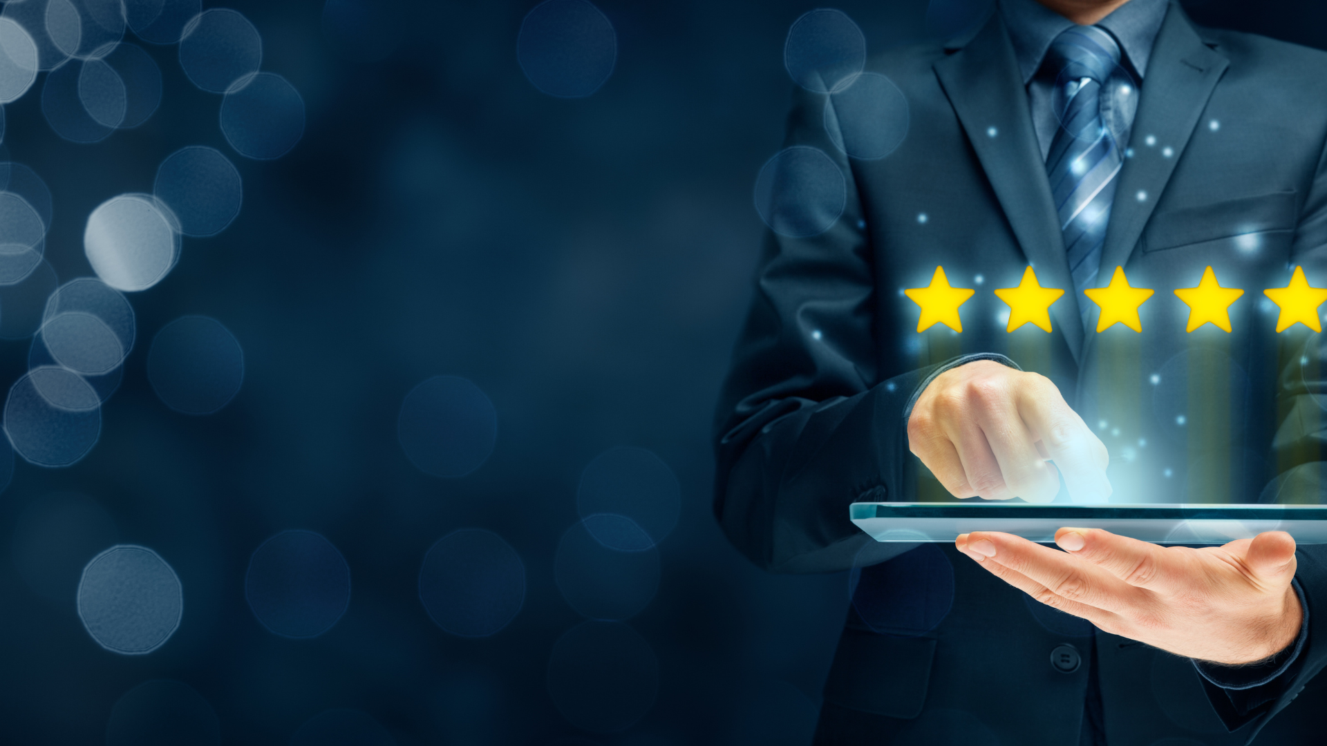 Businessperson using a tablet with five glowing stars, suggesting a five-star rating.