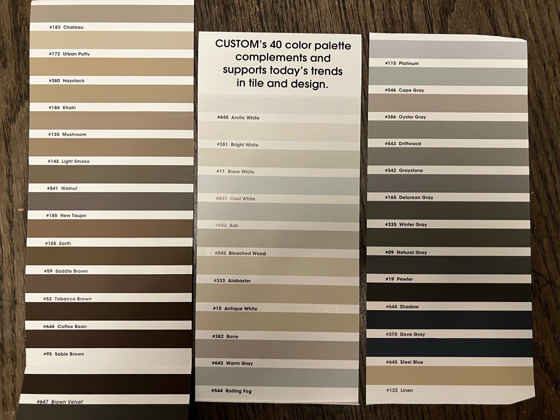 Color palette with three columns of paint swatches in neutral tones.