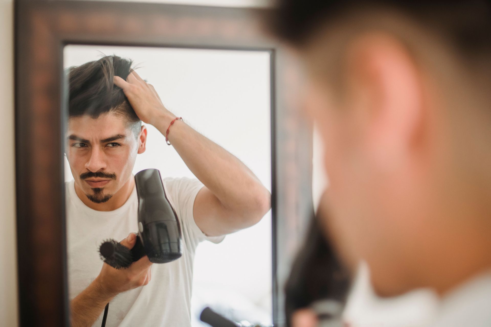 Man Running Fingers Through His Hair
