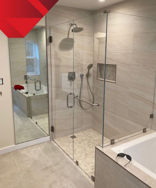 A bathroom with a walk in shower and a bathtub
