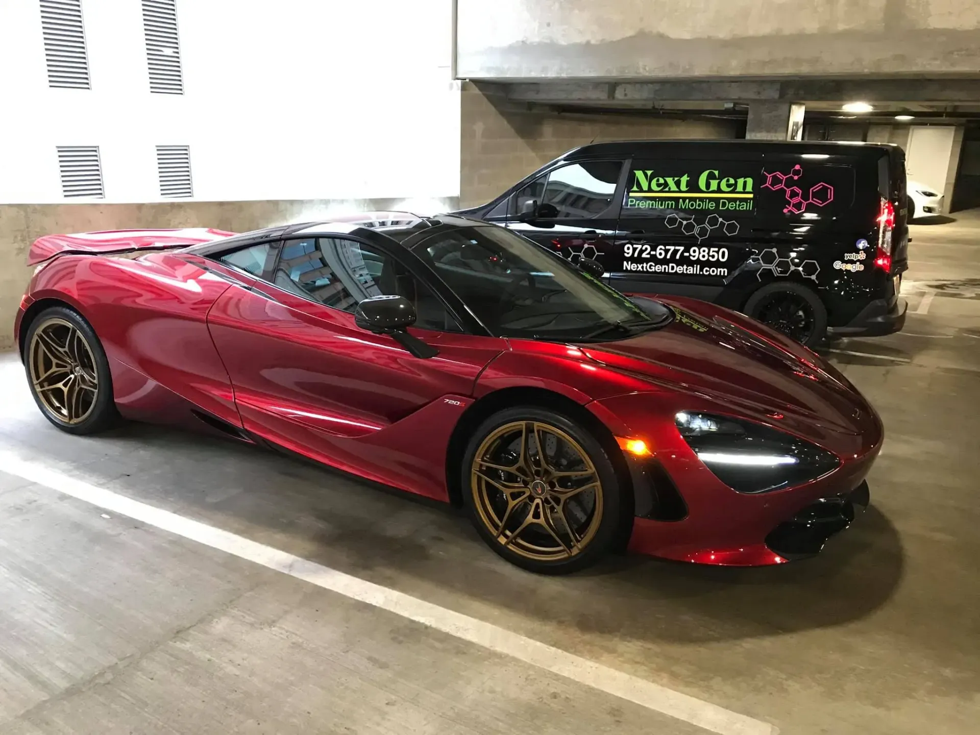 Red sports car parked in a garage for vehicle detailing in Frisco, TX.
