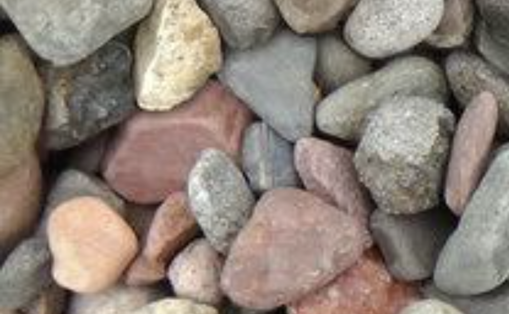 A pile of rocks of different colors and sizes.