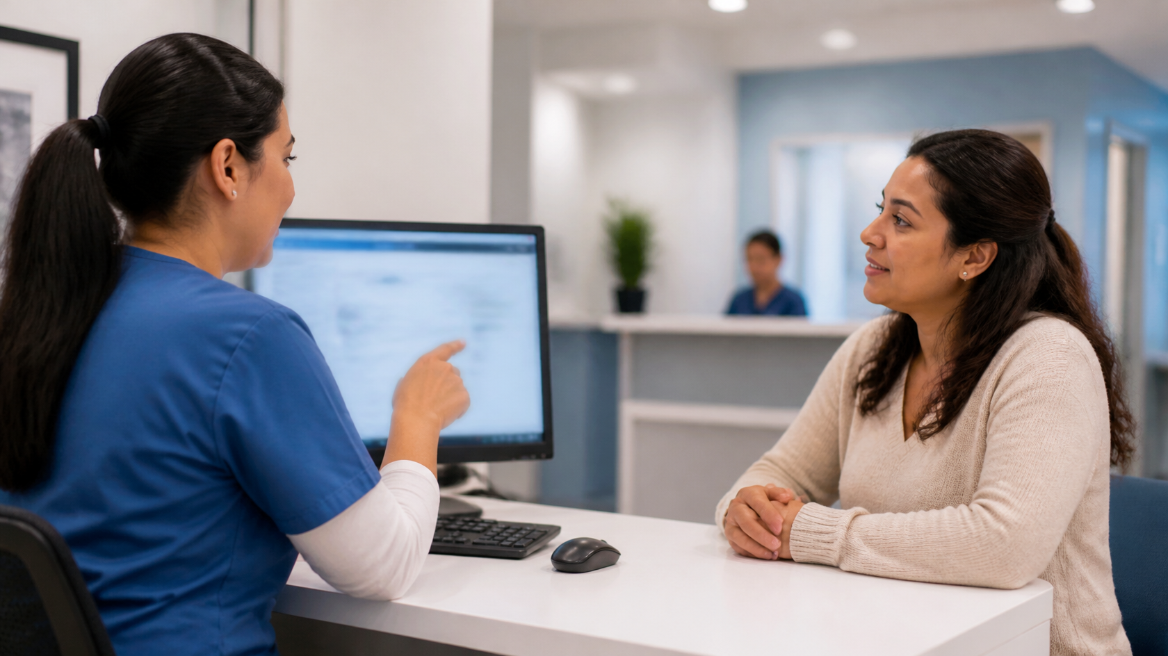 Healthcare professional using a digital intake workflow while assisting a Spanish-speaking patient.