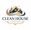 Logo for Clean House Luxury, featuring a navy blue and gold house icon with sweeping lines and elegant scrollwork.