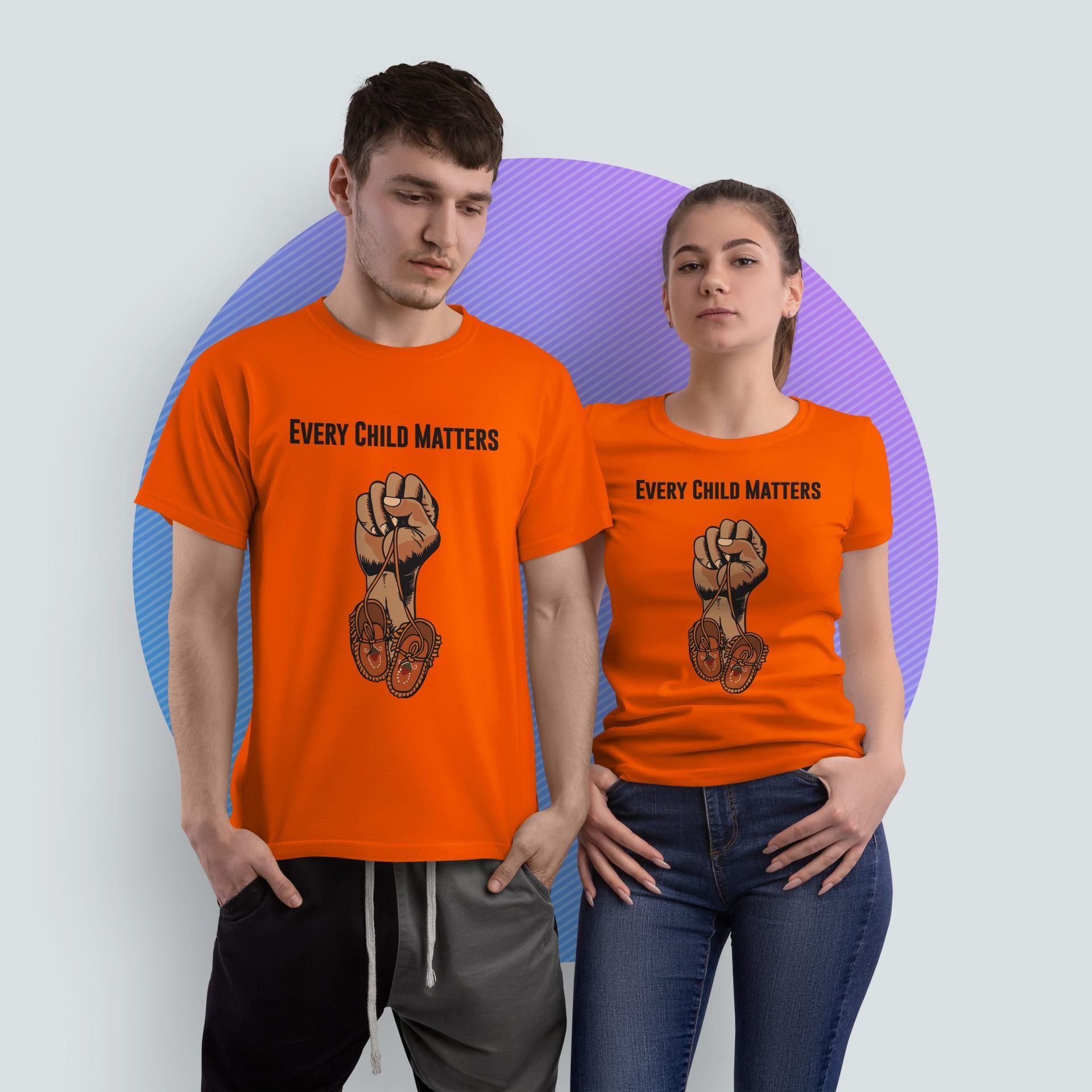 A man and a woman wearing orange shirts that say every child matters