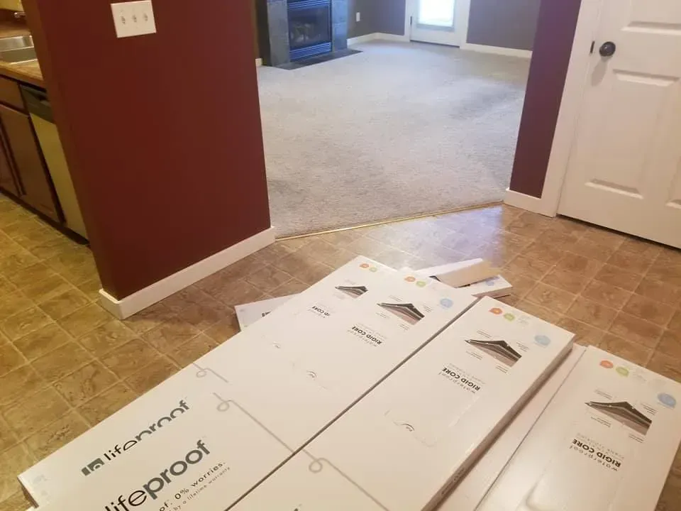 A couple of boxes are sitting on the floor in a room.