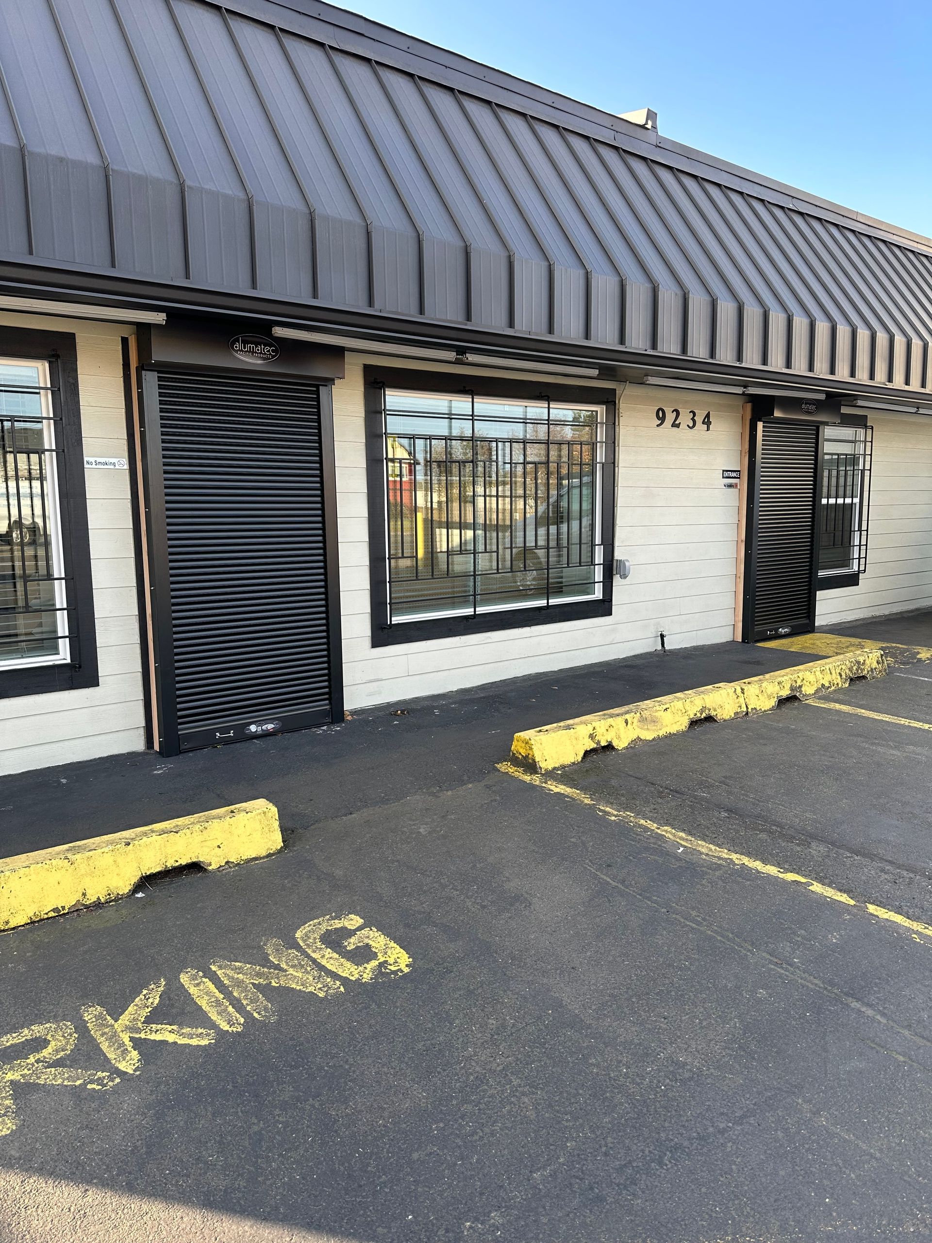 A building with a parking lot in front of it