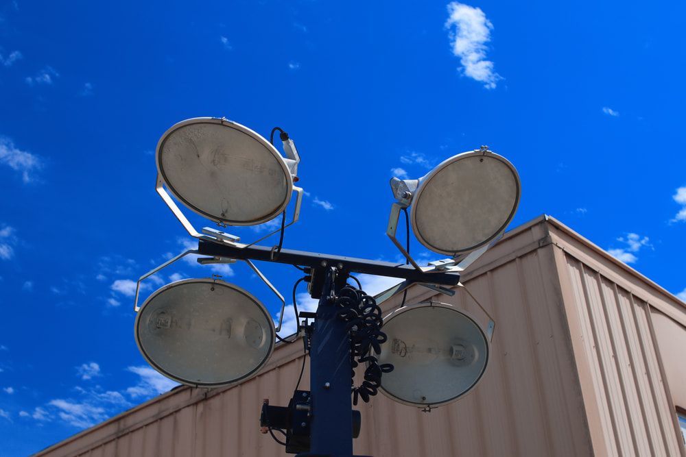 A Tower of Lights Is Sitting in Front of A Building — Jason Wenta Electrical Services in Condon, QLD