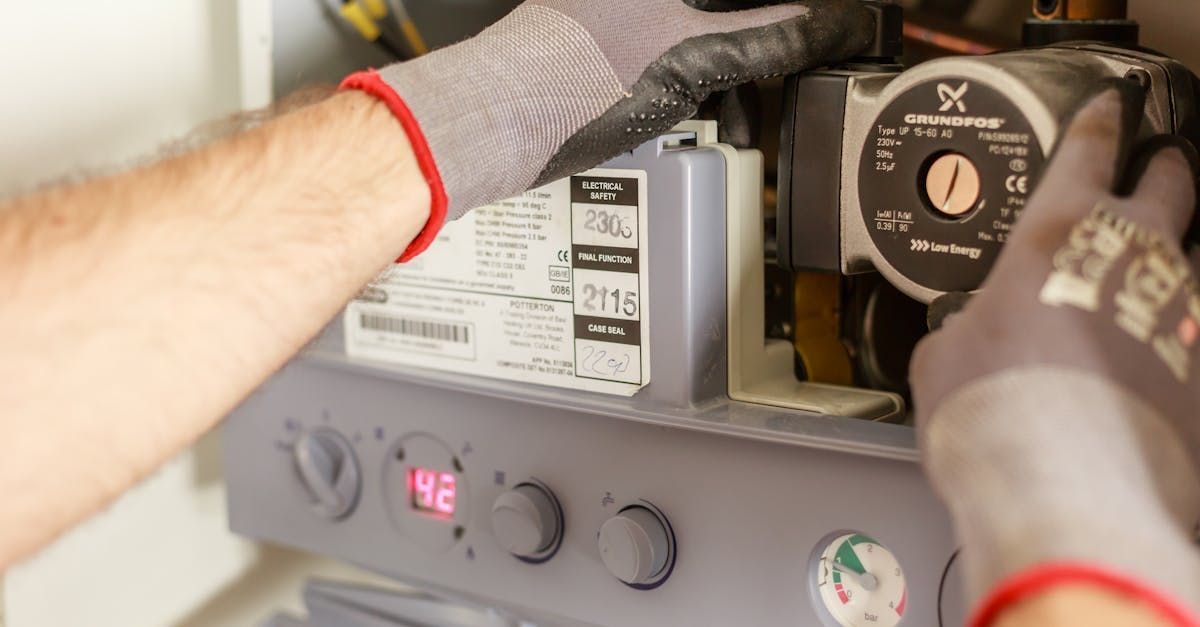 Plumber Fixing an Hot Water Heater — Jason Wenta Electrical Services in Condon, QLD