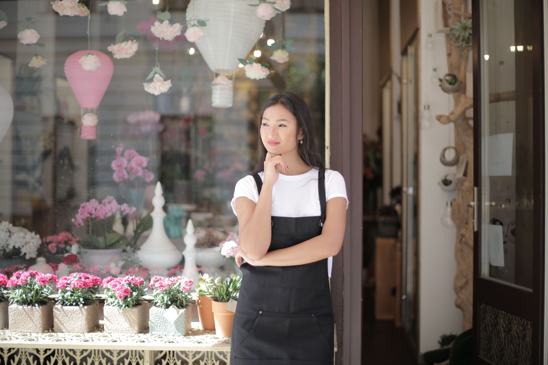 Confident Colorado small business owner in their storefront, protected by life insurance.