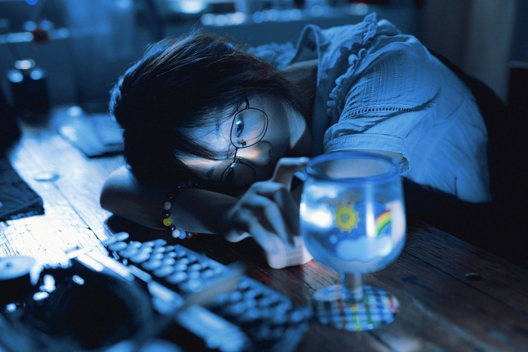 person working from home, looking fatigued - Short term Covid insurance