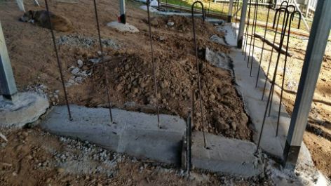 A Pile of Dirt Is Sitting in The Middle of A Construction Site — Conan The House Lifter In Townsville, QLD