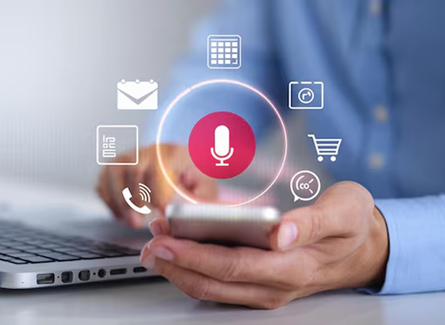 Hand holding a smartphone with colorful UI icons floating around it in a blurred background