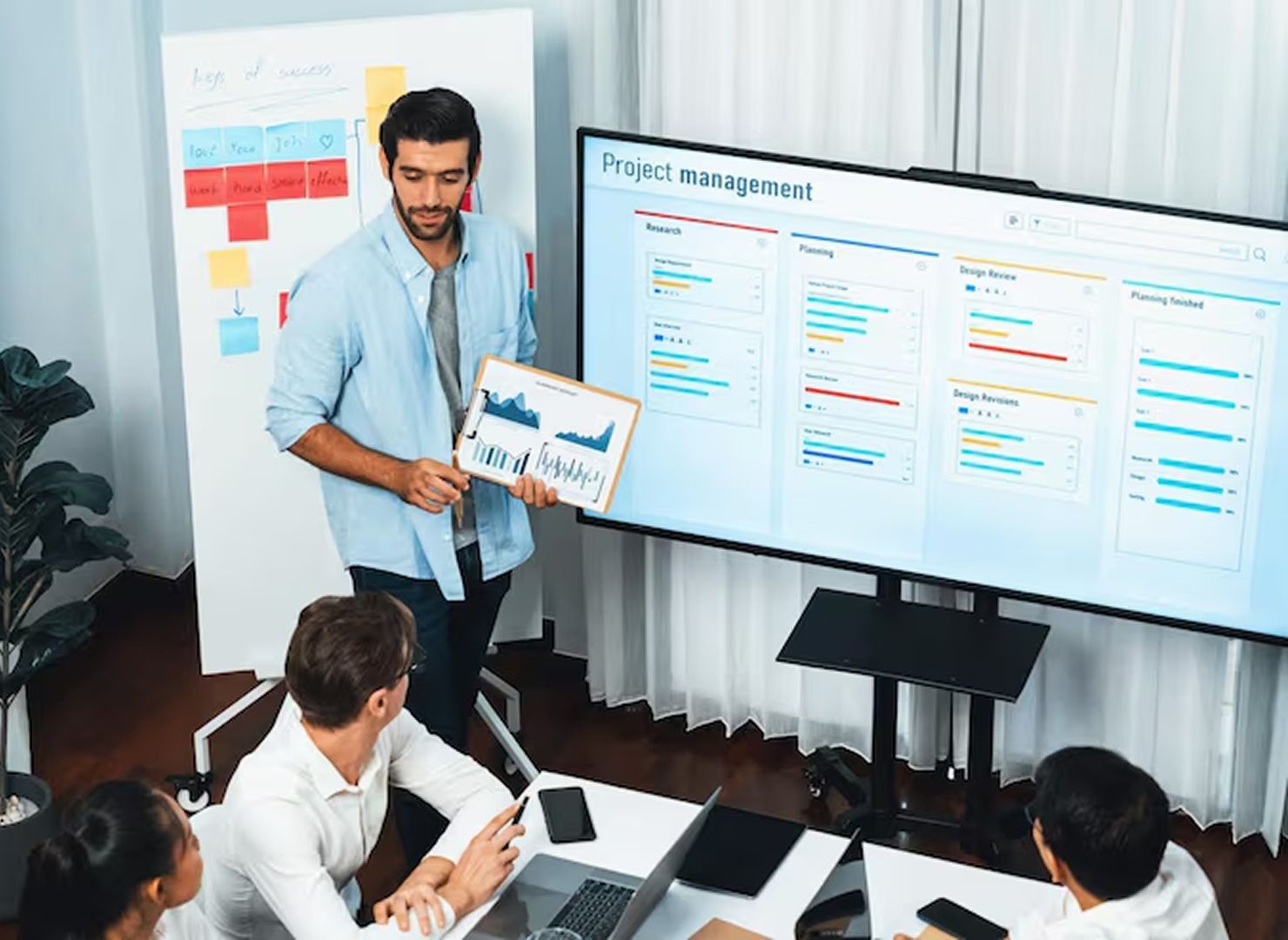 Business landing page with blue layout, white headline, and two professionals in a circular photo.