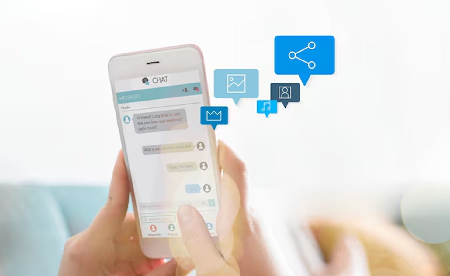 Hand holding smartphone with chat and share icons floating above screen