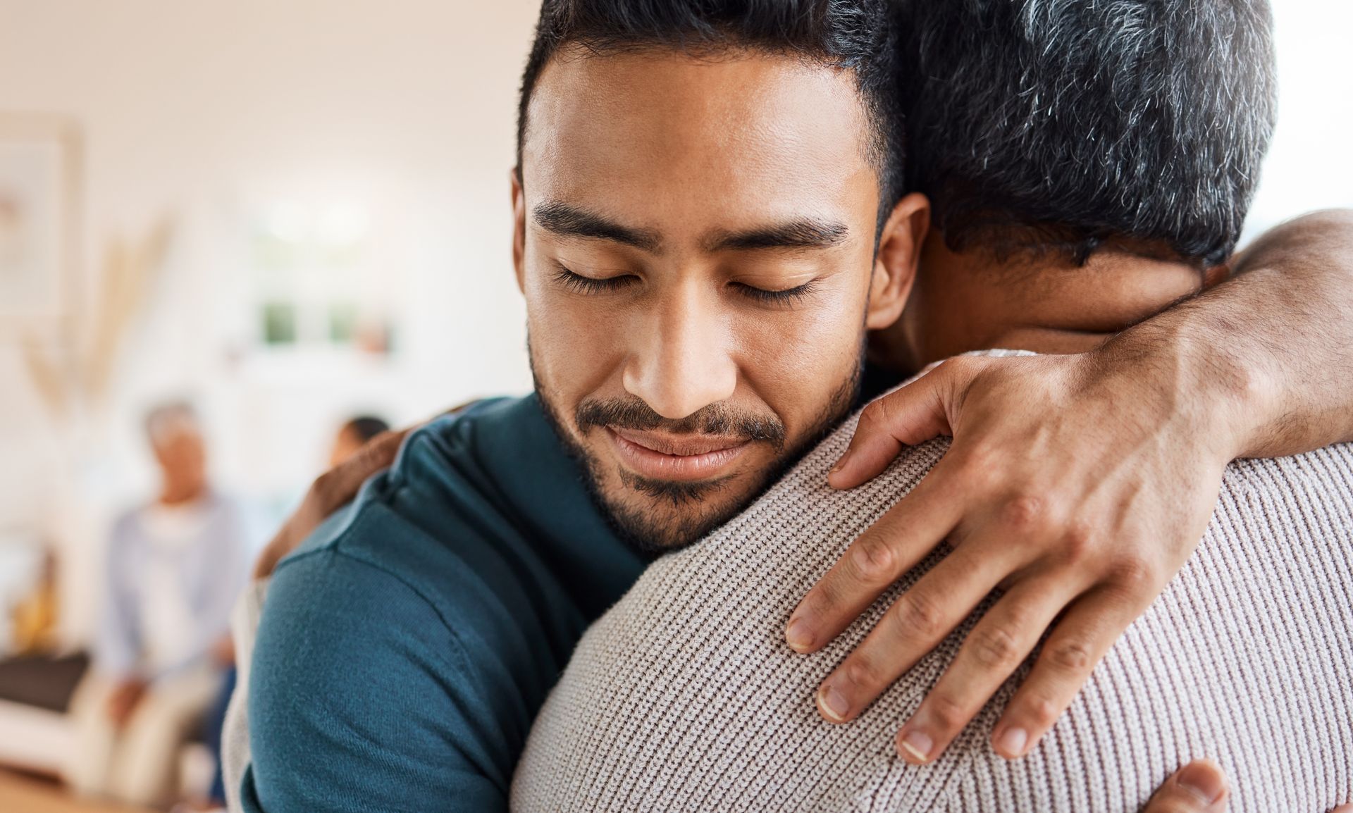 Person embracing a loved one during an emotional moment, representing compassion, grief support, and recovery from emotional trauma.