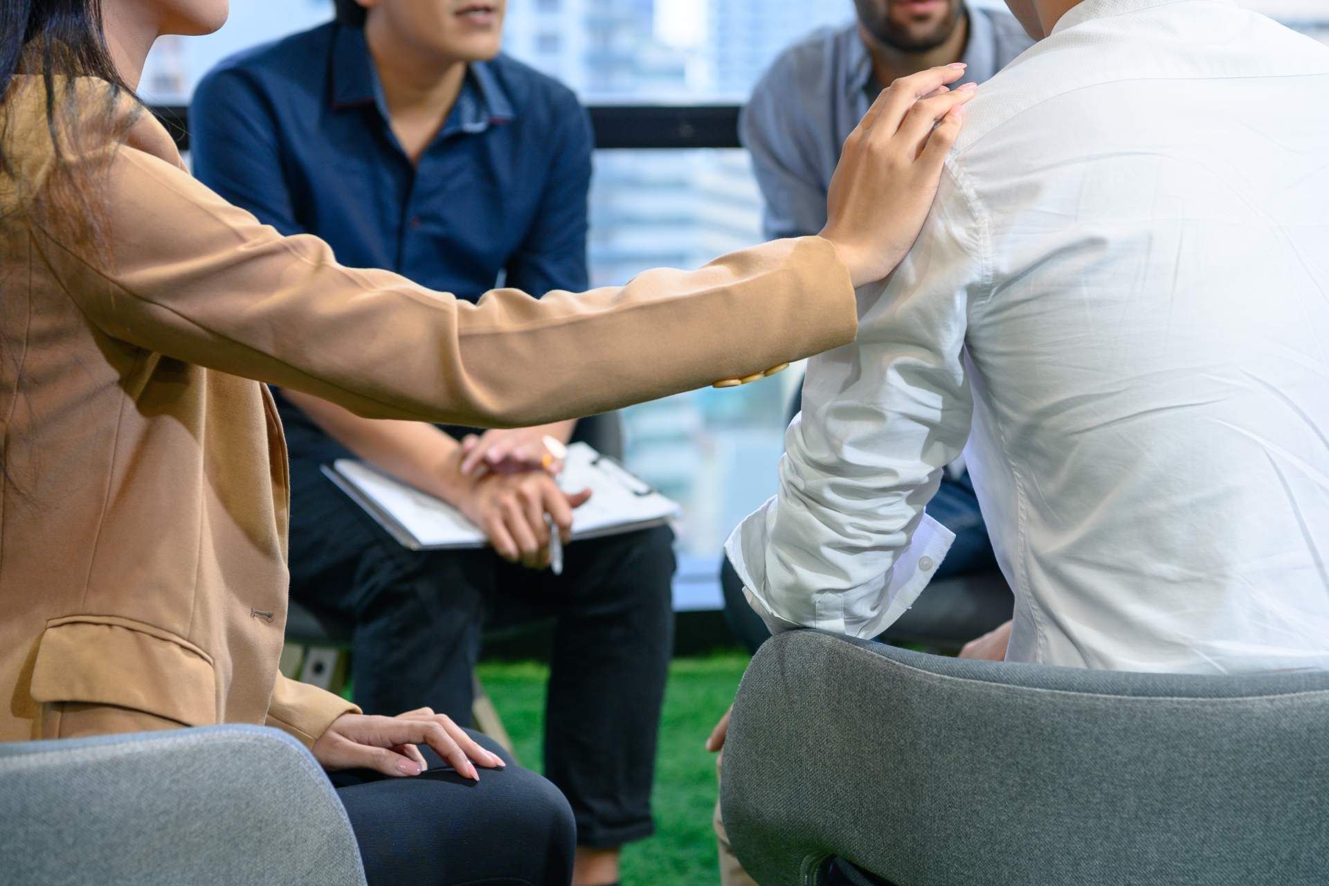 A team in a mental health clinic setting discussing addiction treatment near Danville, Kentucky (KY)