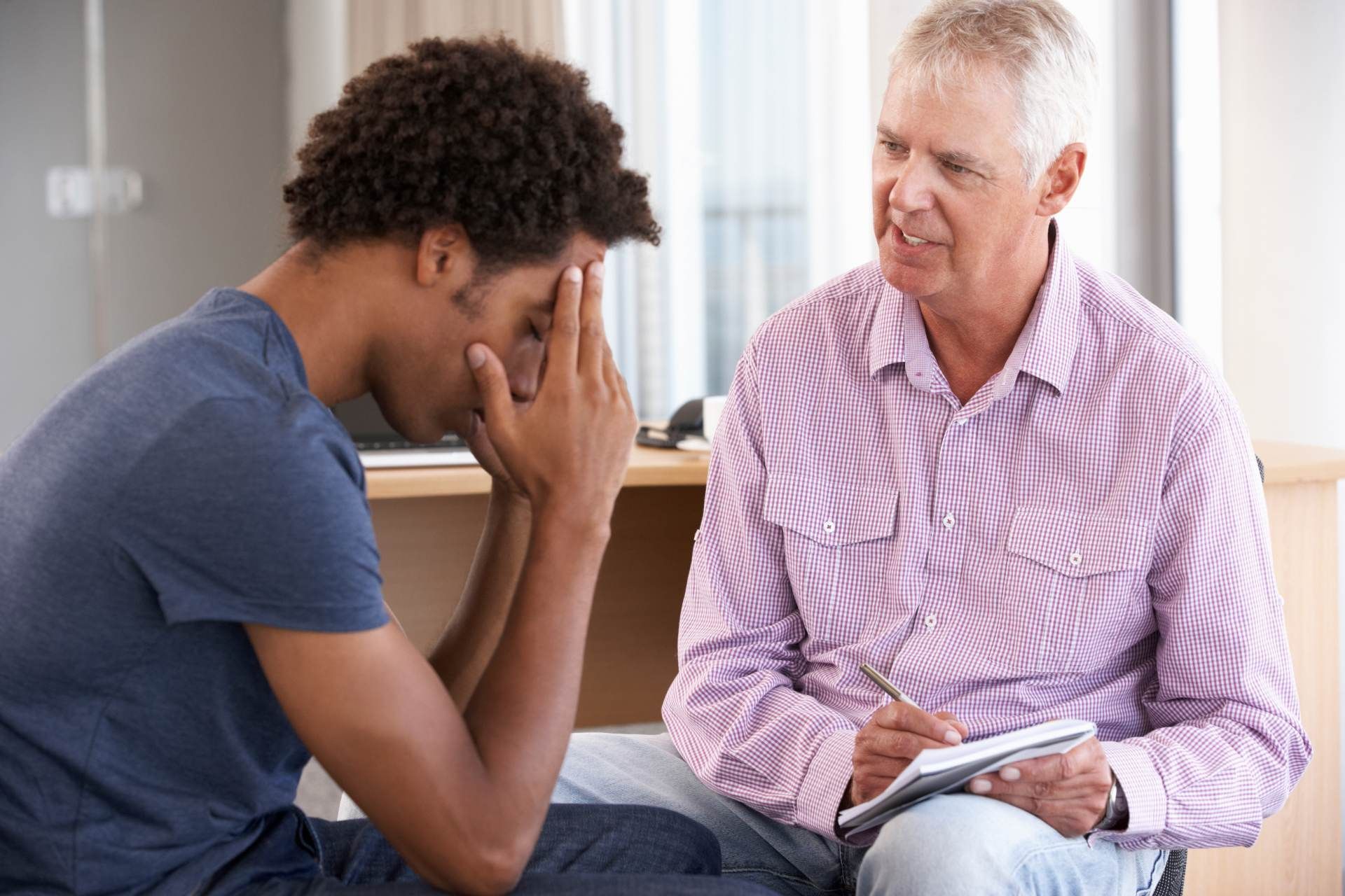 A person supporting a second person in the doctor’s office near Danville, Kentucky (KY).