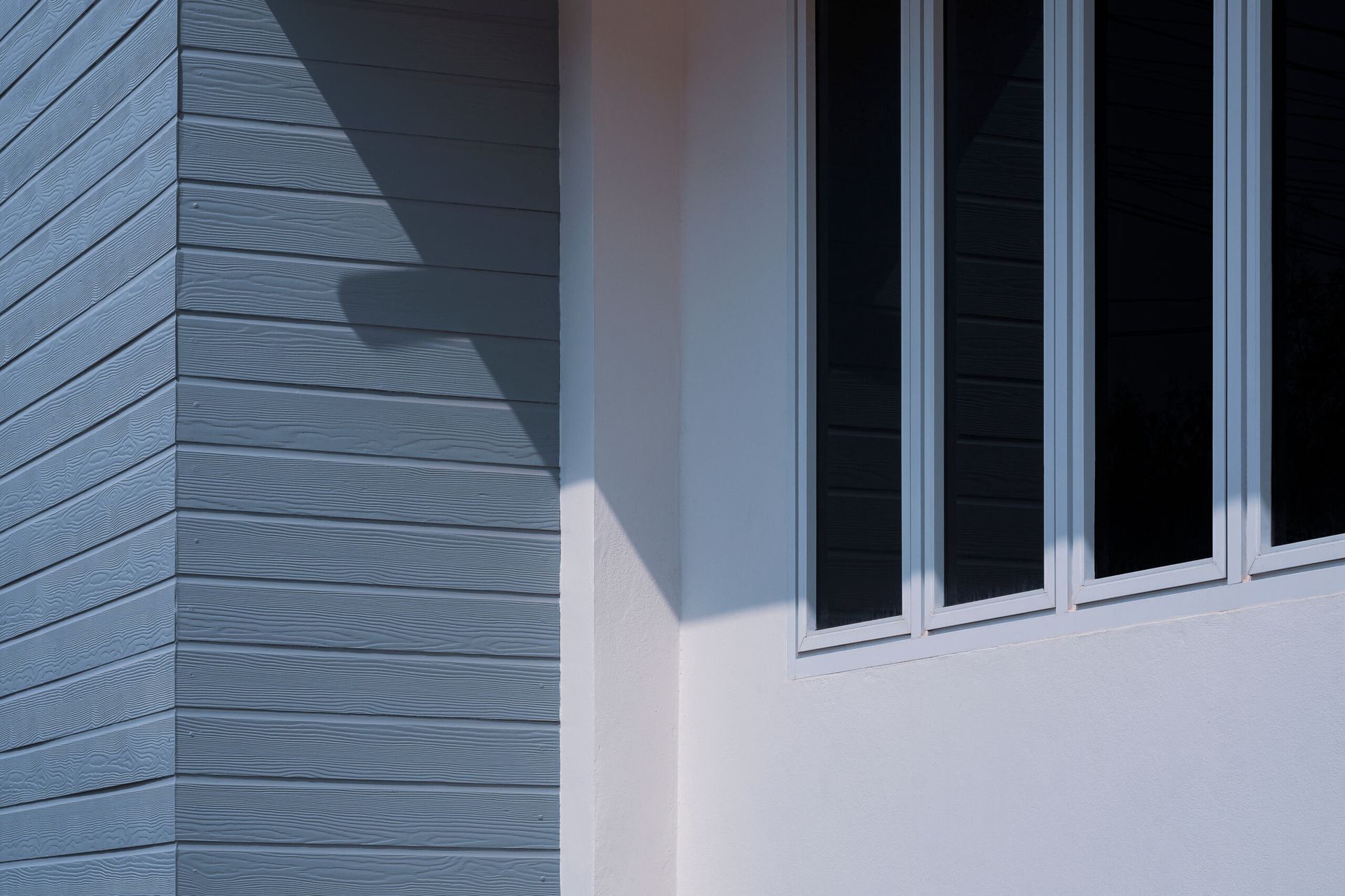 A Corner Of A Building With A Window And A Brick Wall — A & C Classic Window Tinting In Maitland Vale, NSW