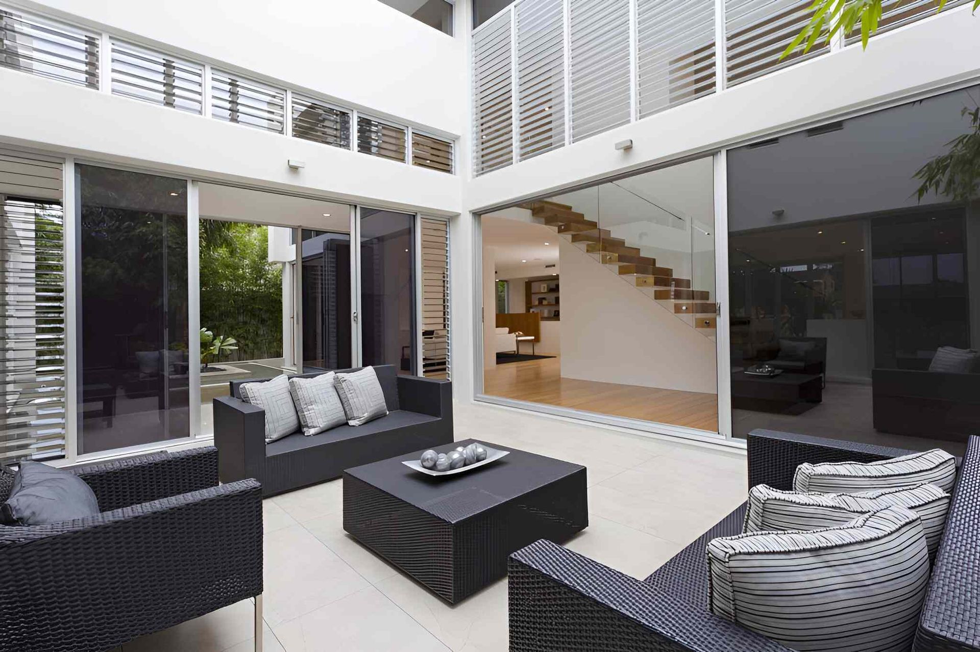 A Living Room With A Couch And Chairs And A Table — A & C Classic Window Tinting In Maitland Vale, NSW