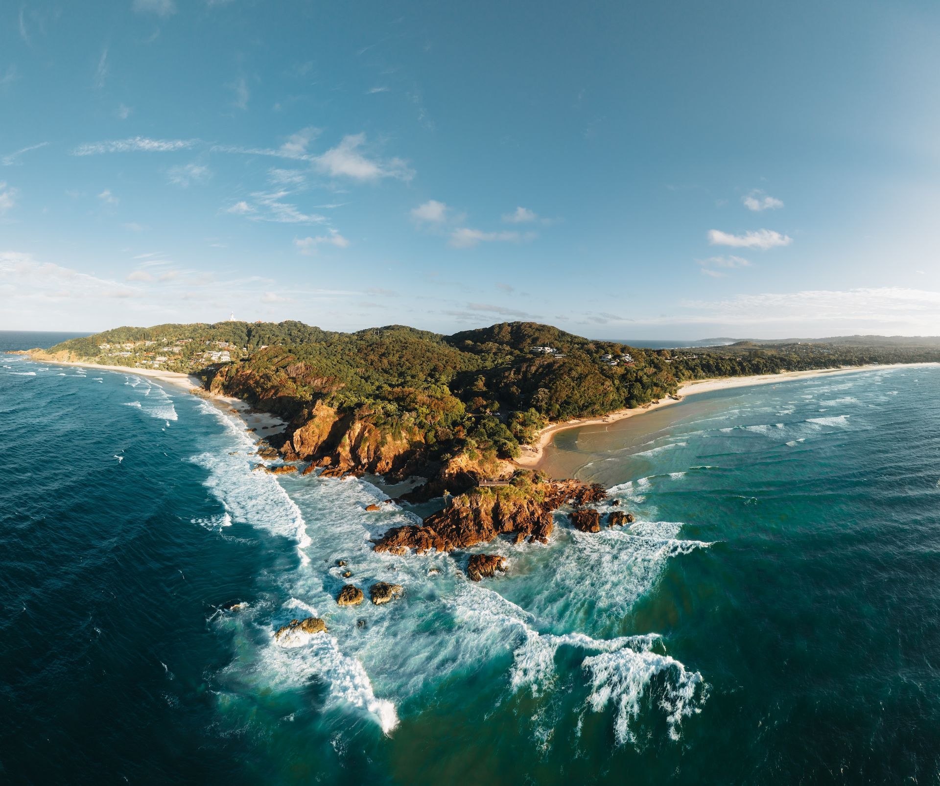 Aerial View of a Lush, Green Island Surrounded by Turquoise Water — Restoradrive in Byron Bay, NSW