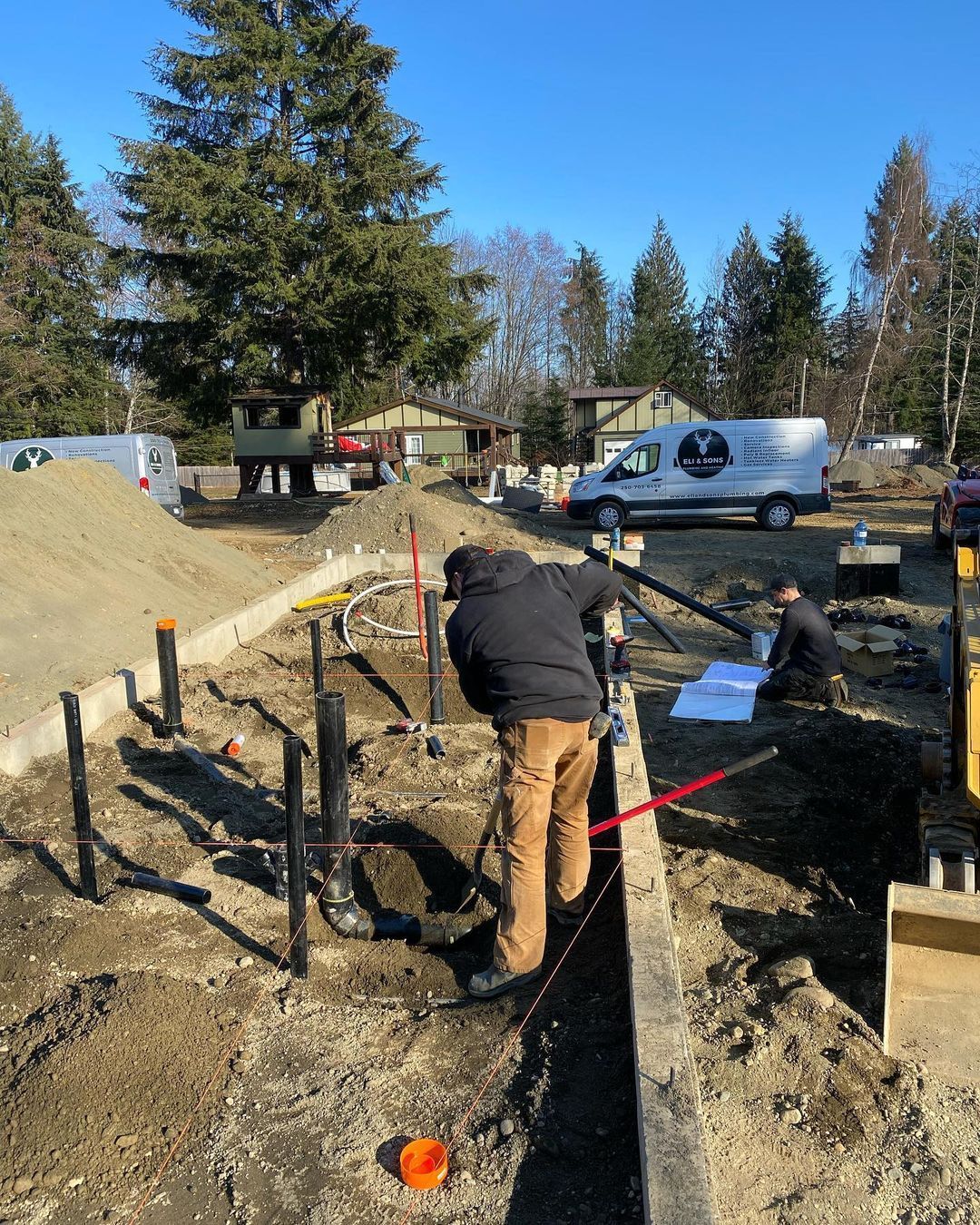 A man is digging in the dirt with a shovel.
