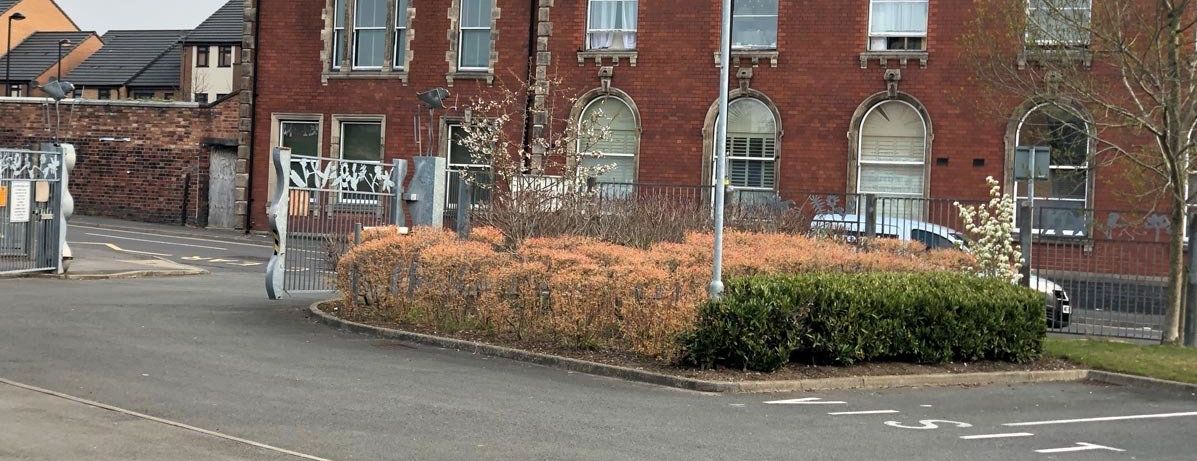 A brick building with graffiti on the side of it