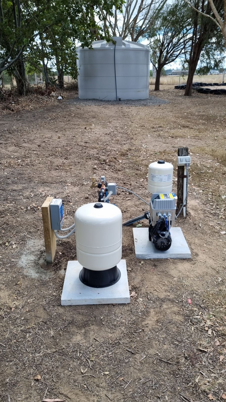 Water Well System With Tank in the Background — Wilson's Drilling in South Kolan, QLD