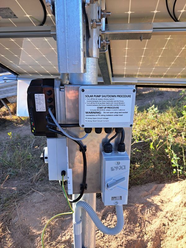 Solar Panel System With a Control Box and a Motor Attached to a Metal Pole — Wilson's Drilling in South Kolan, QLD