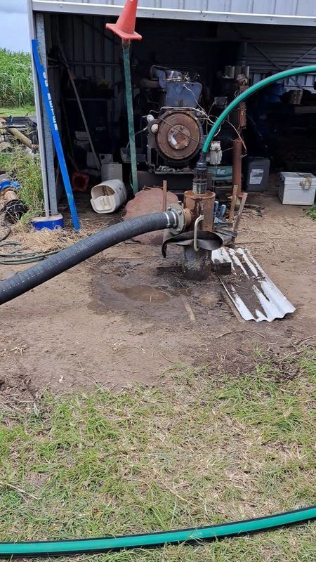 An Outdoor Scene With a Pump Connected to a Hose — Wilson's Drilling in South Kolan, QLD