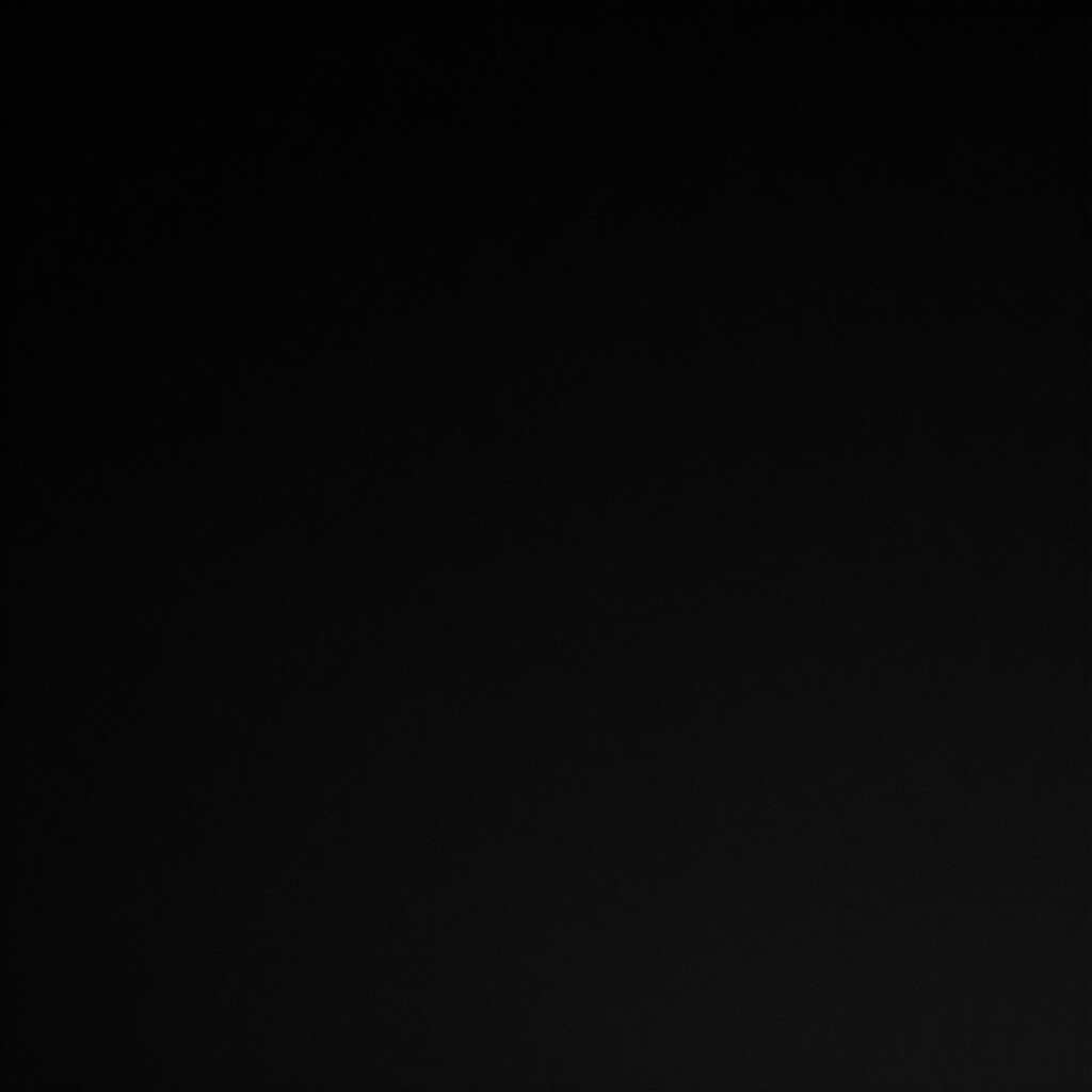 Dark, nearly black image with a faint diagonal gray gradient across the center.