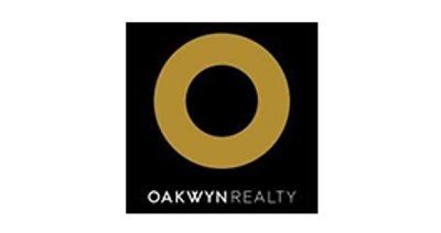 Oakwyn Realty logo with gold ring on black background and white text below