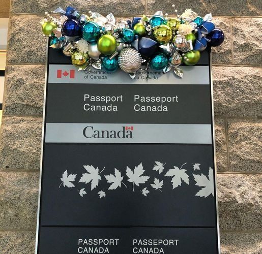 Canadian passport with colorful bead decorations on top