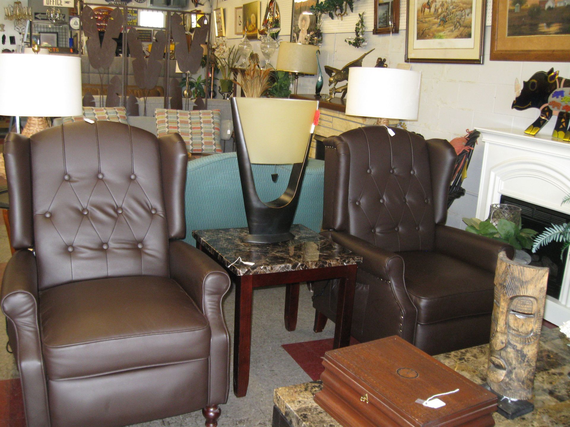 Two leather recliners flanking a small table in a decorated living room