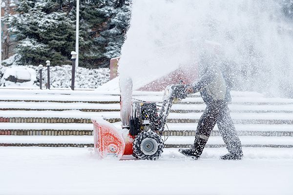 Sidewalk snow blowing