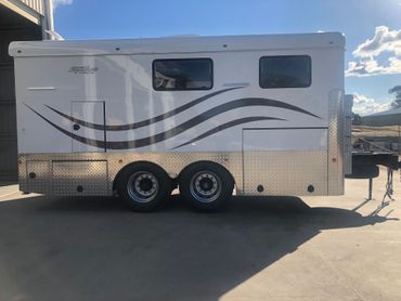 BBQ and fridge in the back of a trailer