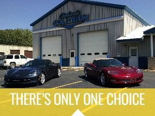 Two sports cars parked outside a garage with “There’s only one choice” text at the bottom.