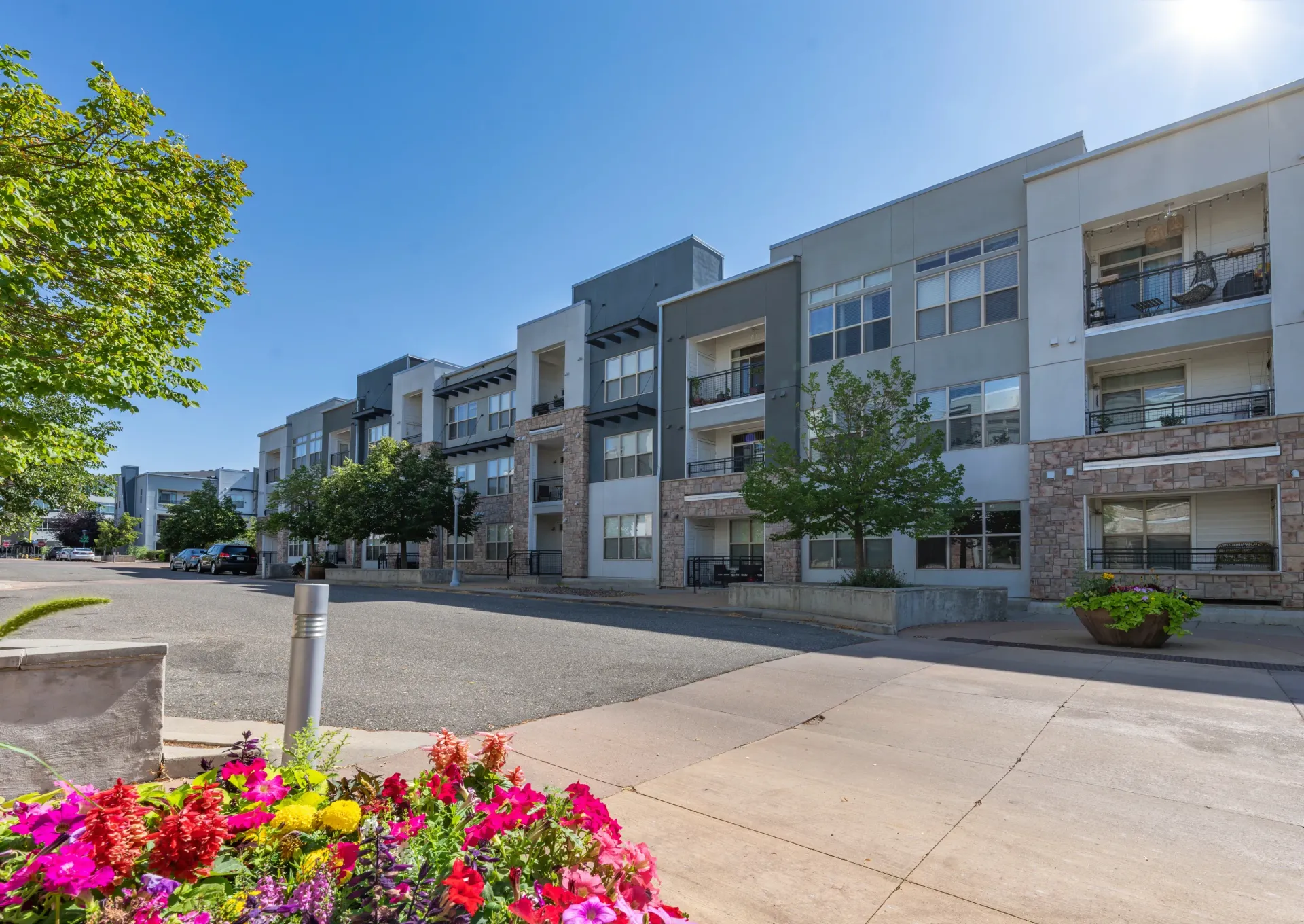 Exterior view of the apartment building with balconies and landscaping.
