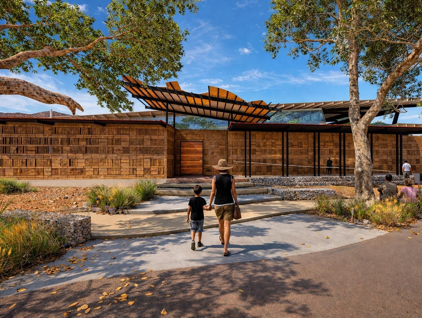 A shaded pedestrian walkway lined with decorative tree-shaped structures, benches, and information signs.