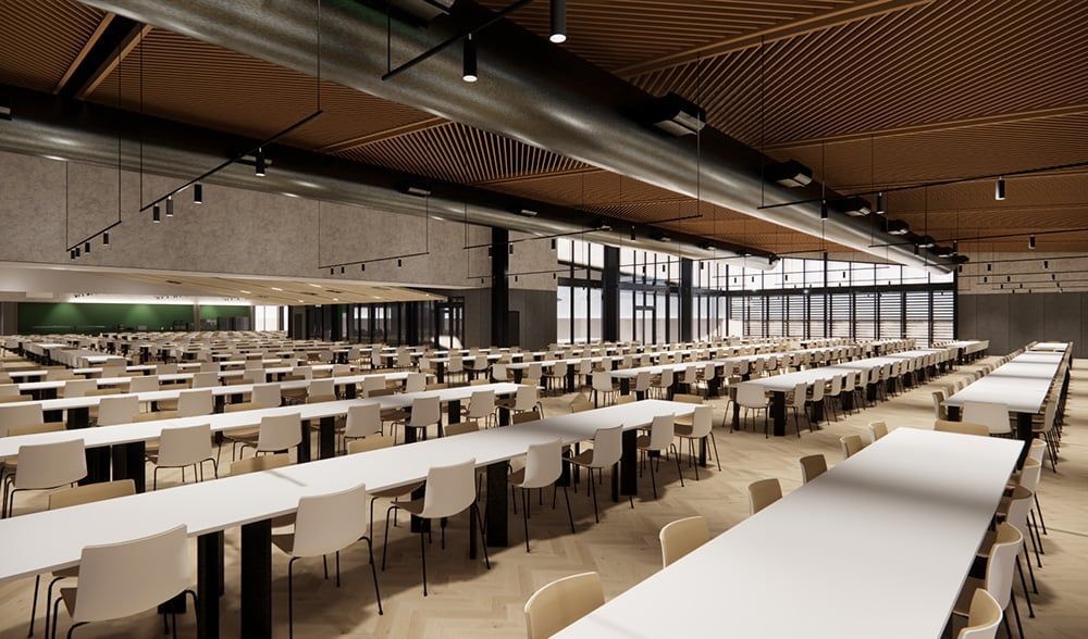 A large, modern cafeteria with rows of white tables, chairs, and an industrial-style ceiling with wooden accents.