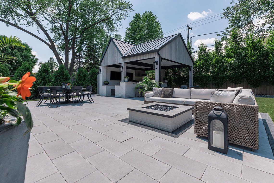 There is a fire pit in the middle of the patio.