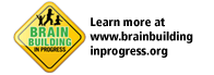 A yellow diamond-shaped sign with silhouettes of children, text