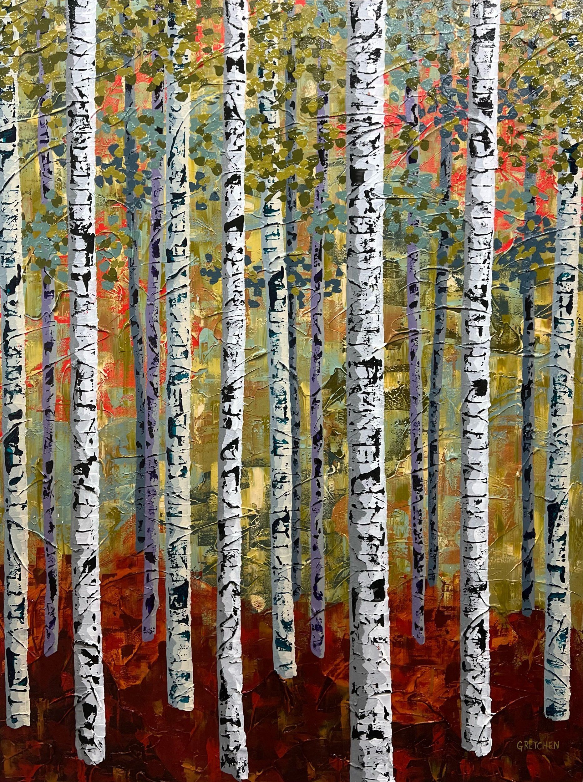 Birch trees with white bark and black markings in a forest with red, green, and yellow leaves.