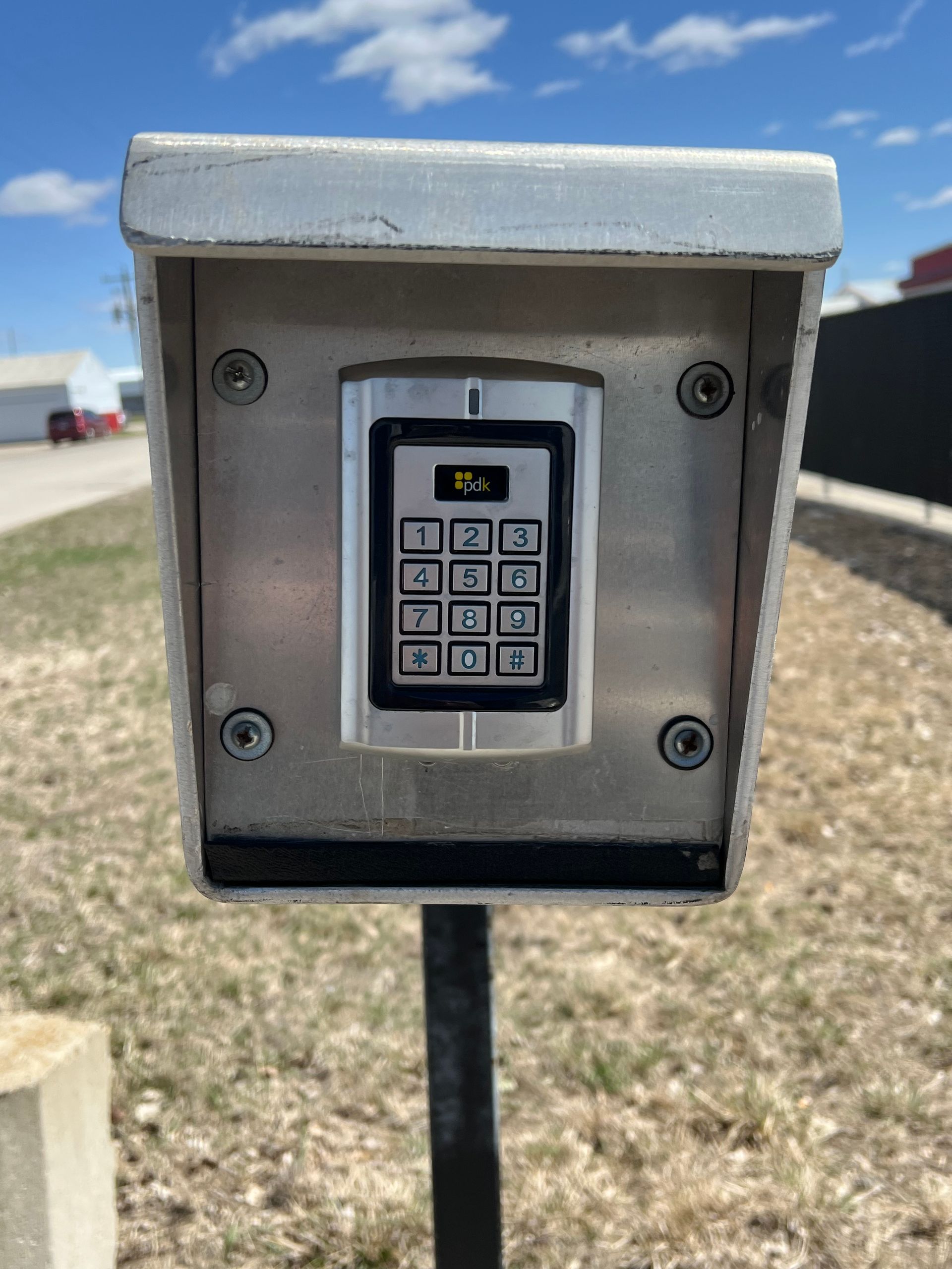 A Man is Using a Keypad to Open a Storage Room