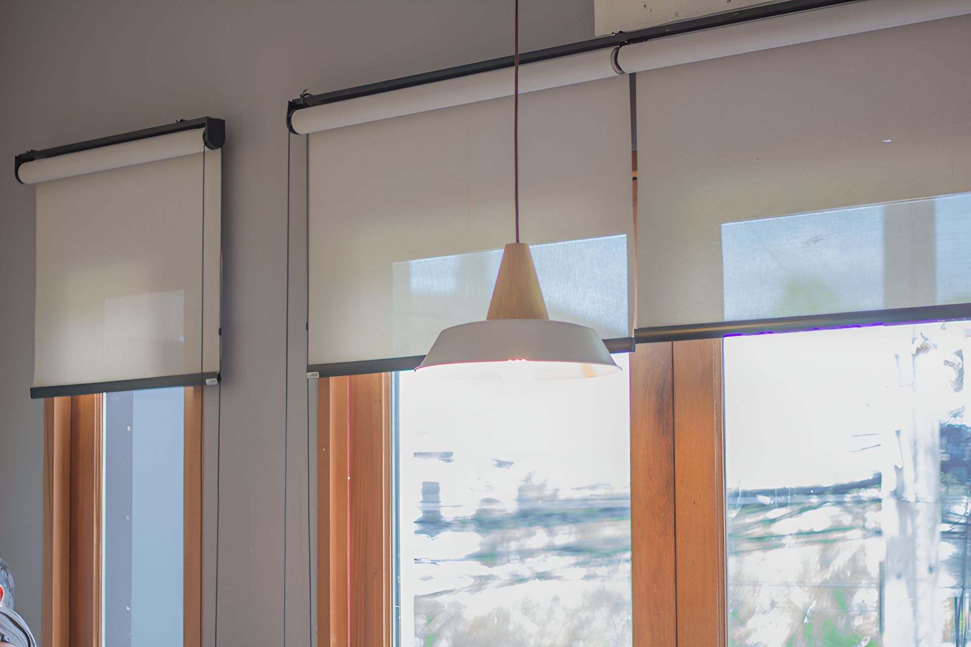 A Close Up Of A Window With Blinds And A Light Hanging From The Ceiling — Roo’s Door & Window Maintenance In Noosa, QLD